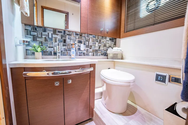 No Shoes Yacht Photos Pics Luxurious bathroom in 2013 Sea Ray 580 Sundancer yacht with modern fixtures and stylish decor.