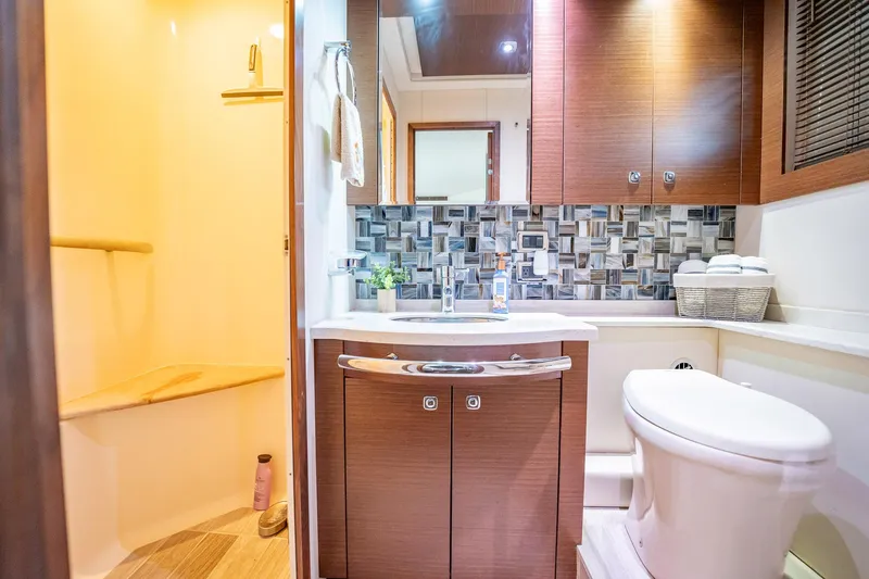 No Shoes Yacht Photos Pics Luxurious bathroom in 2013 Sea Ray 580 Sundancer yacht with modern fixtures and elegant design.