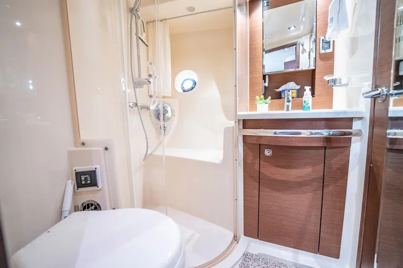 No Shoes Yacht Photos Pics Luxurious bathroom in 2013 Sea Ray 580 Sundancer yacht with shower and vanity.