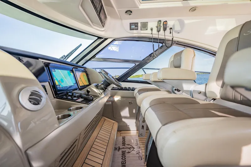 No Shoes Yacht Photos Pics Luxurious interior of 2013 Sea Ray 580 Sundancer yacht with modern navigation equipment.