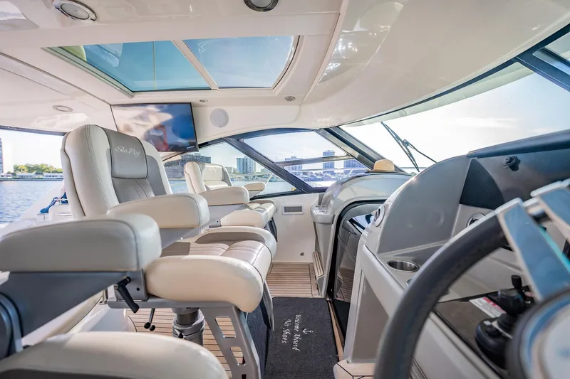 No Shoes Yacht Photos Pics Luxurious 2013 Sea Ray 580 Sundancer yacht interior with plush seating and modern helm.