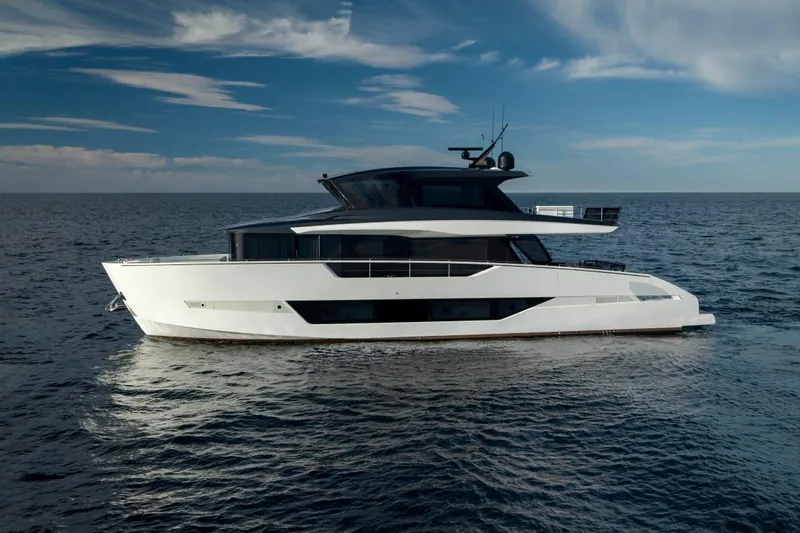 Yachting Conseil Yacht Photos Pics 2025 Astondoa AX8 yacht cruising on open sea under clear blue sky.