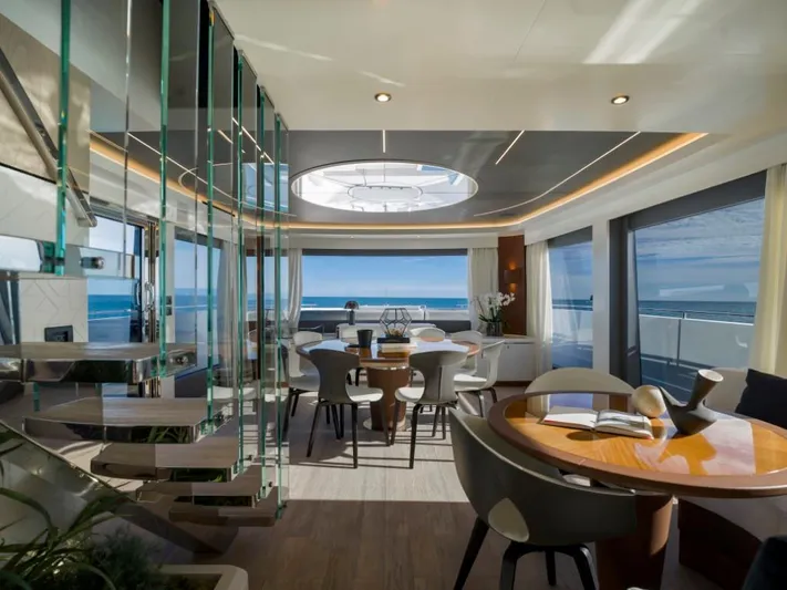 Yachting Conseil Yacht Photos Pics Luxurious interior of 2025 Astondoa AX8 yacht with ocean view and modern furnishings.