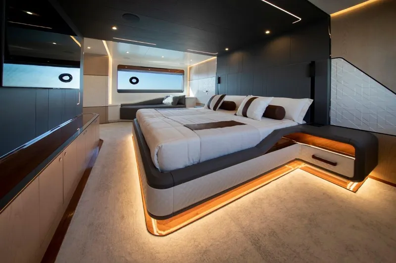 Yachting Conseil Yacht Photos Pics Luxurious bedroom interior of 2025 Astondoa AX8 yacht with modern design and ambient lighting.