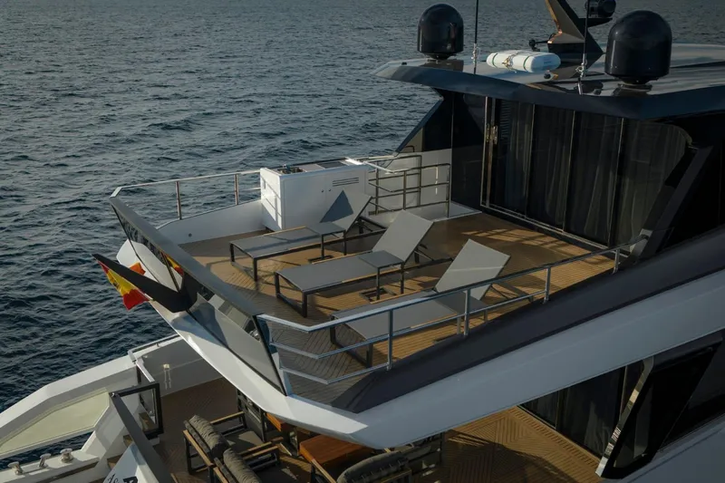 Yachting Conseil Yacht Photos Pics Luxurious 2025 Astondoa AX8 yacht deck with sun loungers and ocean view.
