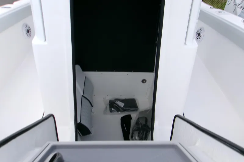  Yacht Photos Pics Interior view of 2026 Blackfin 262 HB boat cabin with seating and storage.