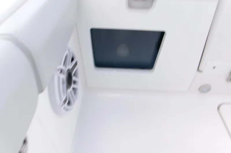  Yacht Photos Pics Interior detail of 2026 Blackfin 262 HB boat, featuring speaker and storage compartment.