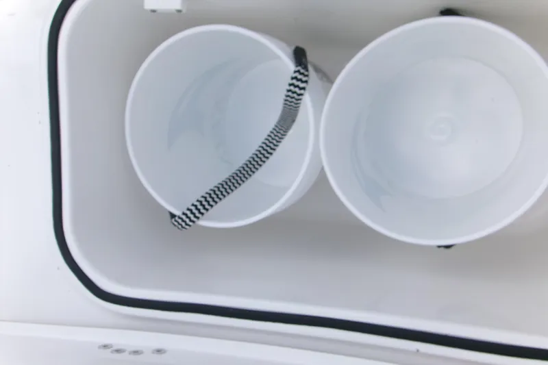  Yacht Photos Pics Two white buckets inside a Blackfin 262 HB boat compartment, 2026 model.