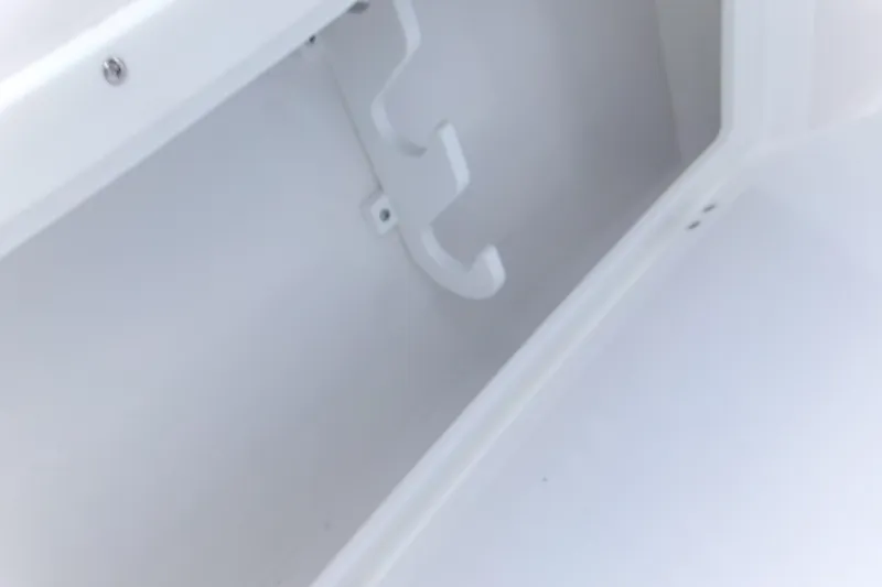 Yacht Photos Pics White interior compartment of 2026 Blackfin 262 HB boat, featuring hooks and smooth surfaces.