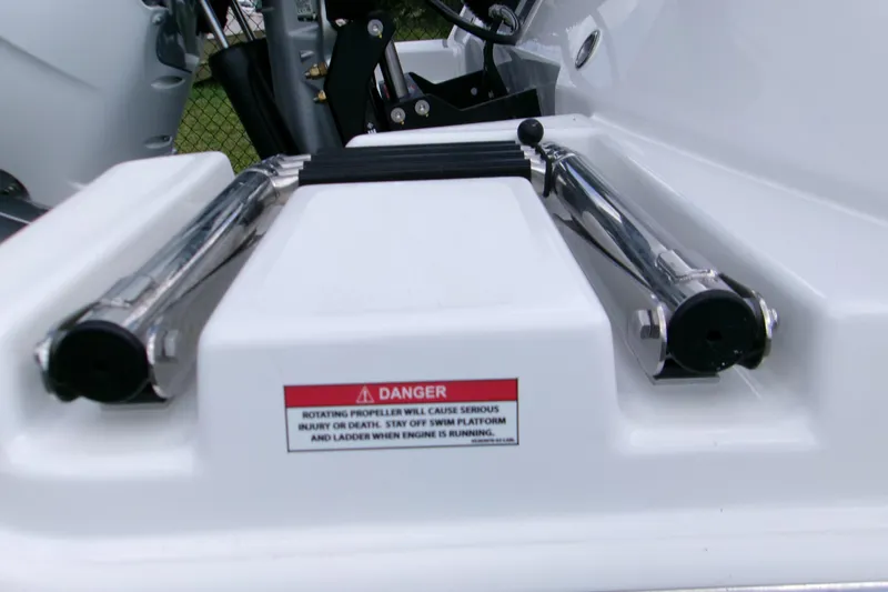  Yacht Photos Pics 2026 Blackfin 262 HB boat ladder with safety warning label.