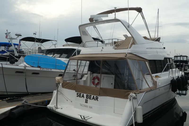  Yacht Photos Pics 1994 Bayliner 4388 Motor Yacht docked at marina, rear view.