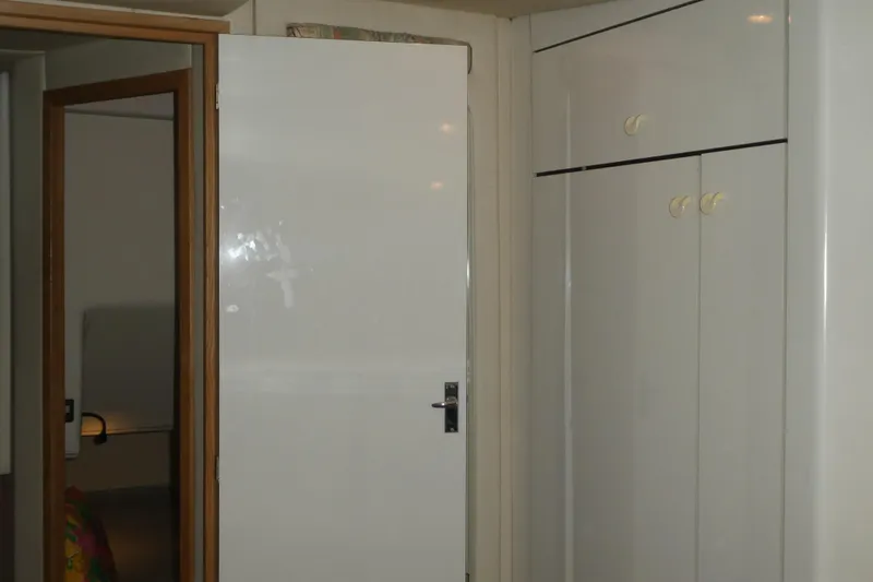  Yacht Photos Pics Interior of 1994 Bayliner 4388 Motor Yacht with white door and cabinets.