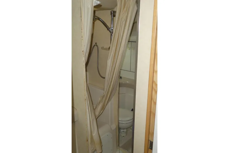  Yacht Photos Pics Bathroom interior of 1994 Bayliner 4388 Motor Yacht with shower and toilet.