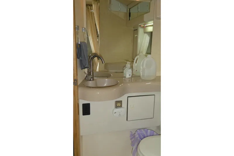  Yacht Photos Pics Bathroom interior of 1994 Bayliner 4388 Motor Yacht with sink and mirror.