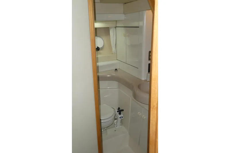  Yacht Photos Pics Bathroom interior of 1994 Bayliner 4388 Motor Yacht with compact design and fixtures.
