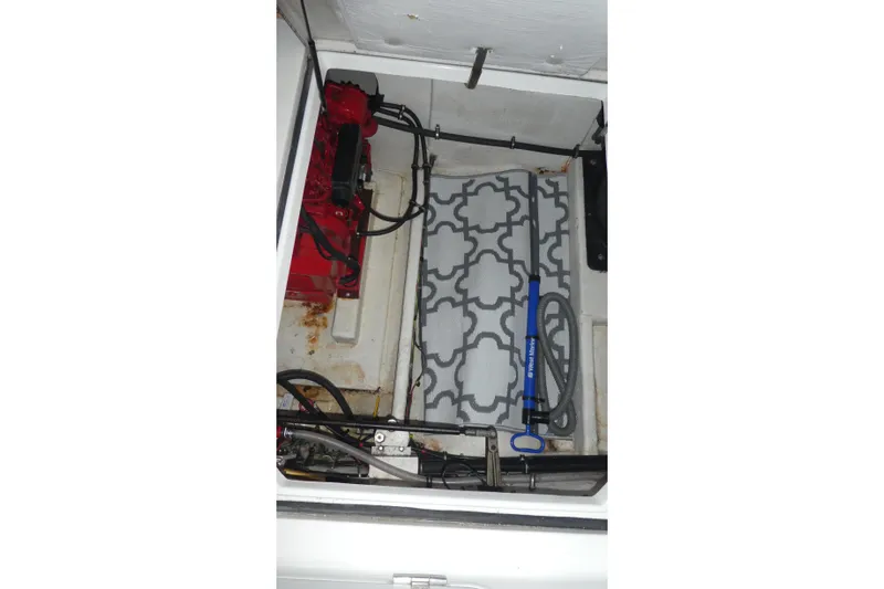  Yacht Photos Pics Engine compartment of a 1994 Bayliner 4388 Motor Yacht with visible equipment and hoses.