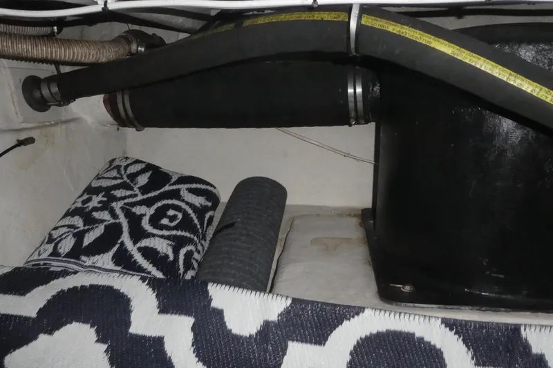  Yacht Photos Pics Engine compartment of 1994 Bayliner 4388 Motor Yacht with hoses and patterned mats.