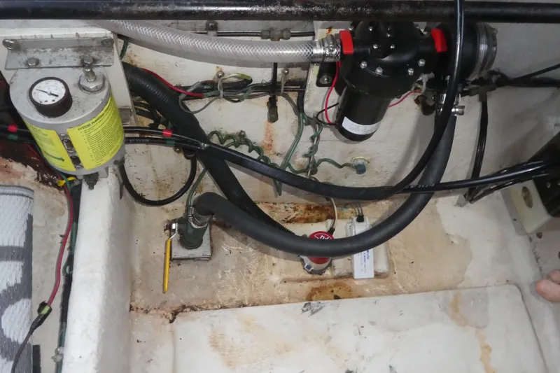  Yacht Photos Pics Engine compartment of a 1994 Bayliner 4388 Motor Yacht, showing hoses and mechanical components.