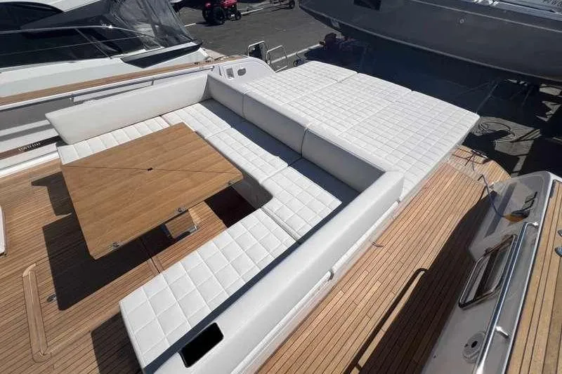 Pardo 50 Yacht Photos Pics Luxurious seating area on 2023 Pardo Yachts Pardo 50 with wooden table.