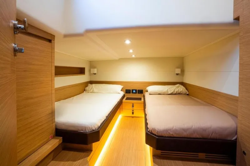 Pardo 50 Yacht Photos Pics Luxurious cabin interior of 2023 Pardo Yachts Pardo 50 with twin beds and modern lighting.
