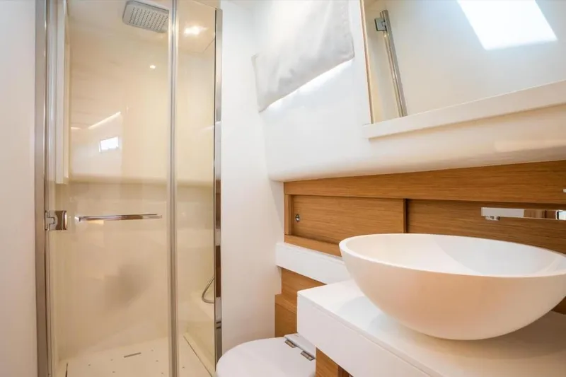 Pardo 50 Yacht Photos Pics Modern bathroom interior of 2023 Pardo Yachts Pardo 50 with sleek shower and vessel sink.