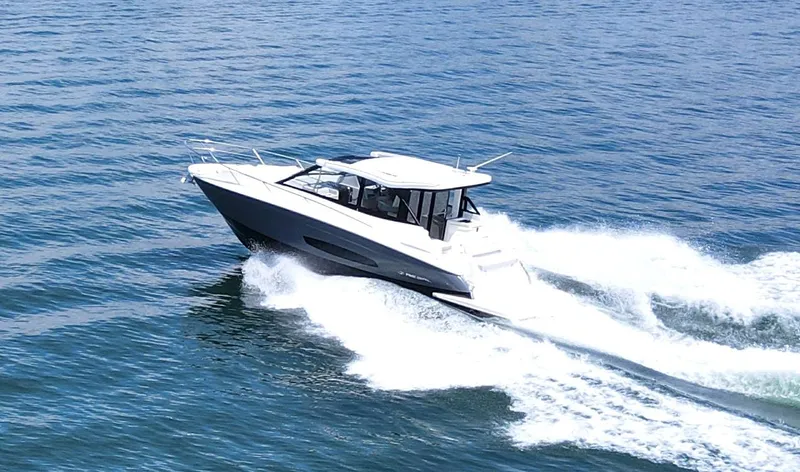 Princess Maya Yacht Photos Pics 2024 Regal 36 Grande Coupe cruising on open water, showcasing sleek design and performance.