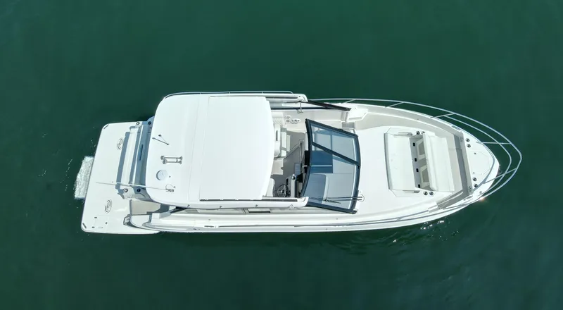 Princess Maya Yacht Photos Pics 2024 Regal 36 Grande Coupe luxury boat on calm water, aerial view.