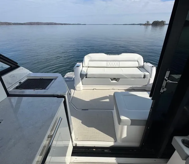 Princess Maya Yacht Photos Pics 2024 Regal 36 Grande Coupe interior with lake view, featuring sleek seating and modern design.