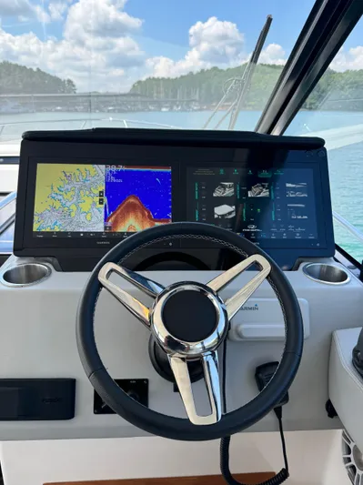 Princess Maya Yacht Photos Pics 2024 Regal 36 Grande Coupe helm with advanced navigation displays on a sunny day.