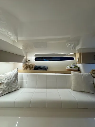 Princess Maya Yacht Photos Pics 2024 Regal 36 Grande Coupe interior with modern white seating and elegant decor.