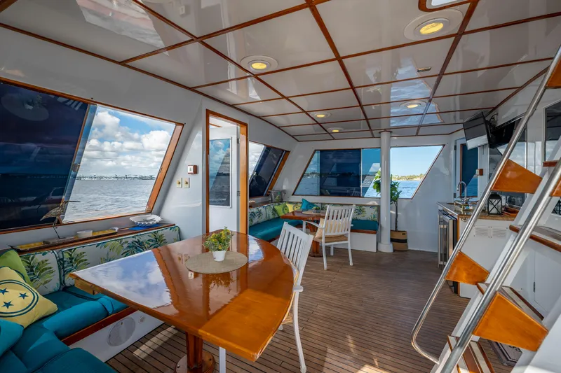  Yacht Photos Pics Luxurious 1985 Cheoy Lee 90 Motor Yacht interior with elegant seating and dining area.