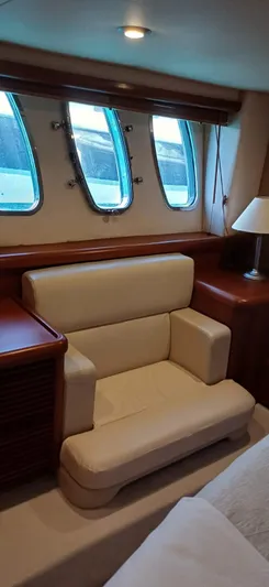  Yacht Photos Pics Luxurious interior of 2006 Sunseeker Manhattan 60 yacht with elegant seating and windows.