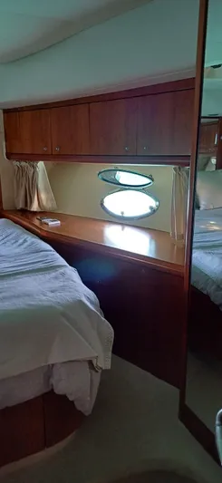  Yacht Photos Pics Luxurious cabin interior of 2006 Sunseeker Manhattan 60 yacht with wooden furnishings.