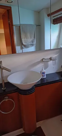  Yacht Photos Pics Bathroom interior of 2006 Sunseeker Manhattan 60 yacht with modern sink and mirror.