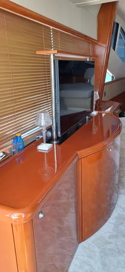  Yacht Photos Pics Luxurious interior of 2006 Sunseeker Manhattan 60 yacht with elegant wood finish.