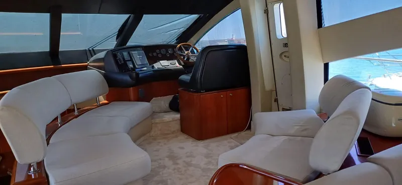  Yacht Photos Pics Luxurious interior of 2006 Sunseeker Manhattan 60 yacht with plush seating and modern helm.