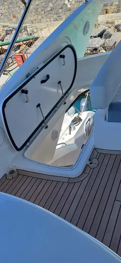  Yacht Photos Pics Sunseeker Manhattan 60 yacht deck with open hatch, 2006 model, showcasing sleek design.