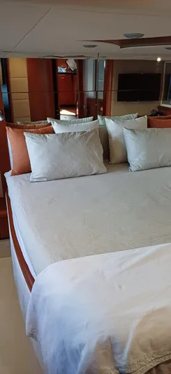  Yacht Photos Pics Luxurious bedroom interior of 2006 Sunseeker Manhattan 60 yacht with elegant bedding.