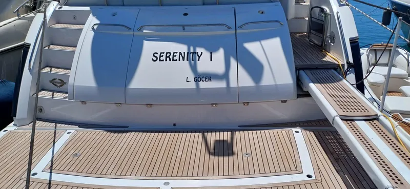  Yacht Photos Pics Sunseeker Manhattan 60 yacht, 2006 model, named "Serenity 1" with teak deck and boarding ramp.