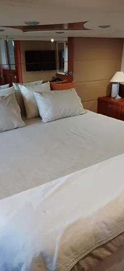  Yacht Photos Pics Luxurious bedroom interior of 2006 Sunseeker Manhattan 60 yacht with elegant bedding.