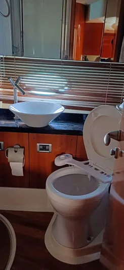  Yacht Photos Pics Bathroom interior of a 2006 Sunseeker Manhattan 60 yacht with modern fixtures.