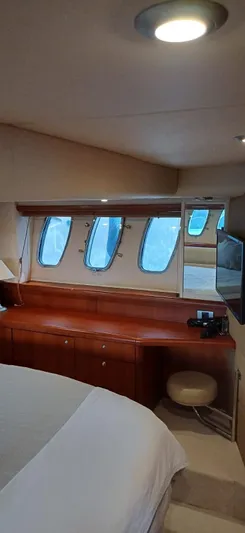  Yacht Photos Pics Luxurious cabin interior of 2006 Sunseeker Manhattan 60 yacht with elegant wood finish.