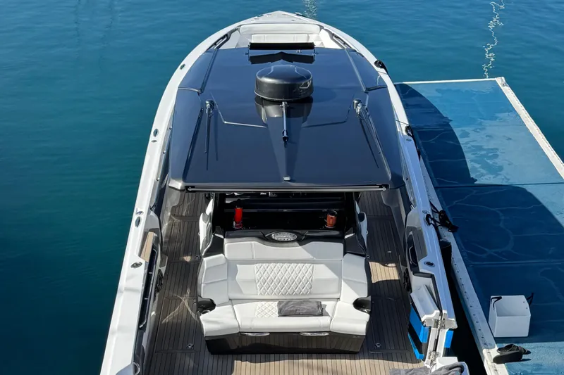  Yacht Photos Pics 2022 Nor-Tech 450 Sport Center Console boat docked on calm water.