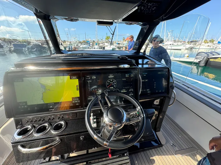  Yacht Photos Pics 2022 Nor-Tech 450 Sport Center Console dashboard with advanced navigation and control systems.
