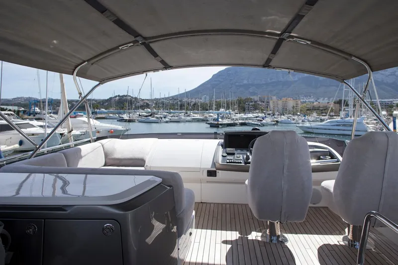  Yacht Photos Pics Luxurious 2022 Princess S66 yacht interior with marina view and mountain backdrop.
