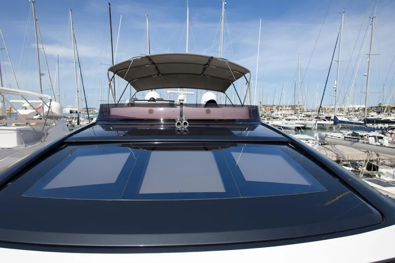  Yacht Photos Pics 2022 Princess S66 yacht docked at marina, showcasing sleek design and modern features.