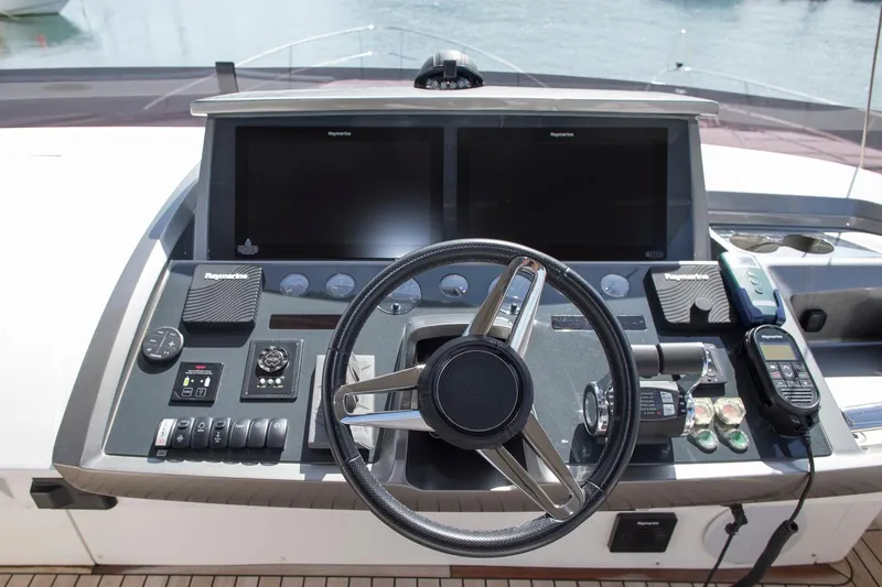  Yacht Photos Pics Steering console of 2022 Princess S66 yacht with advanced navigation controls.