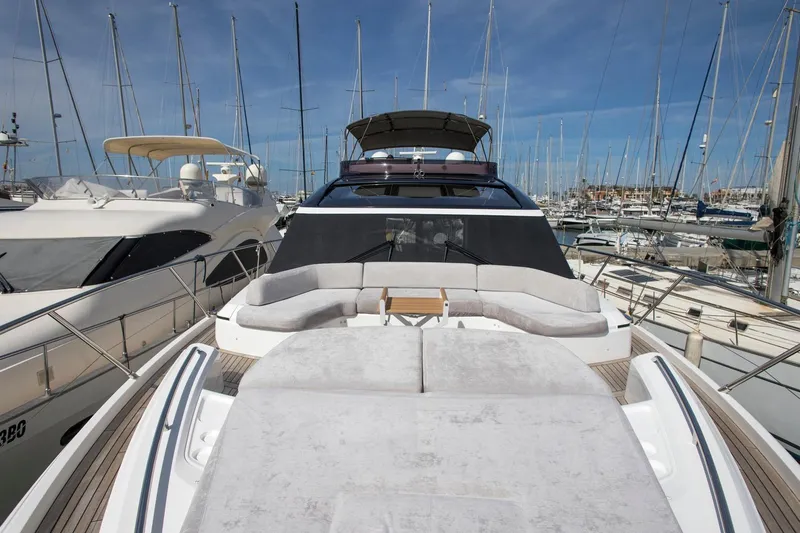  Yacht Photos Pics Luxurious 2022 Princess S66 yacht docked in a marina, showcasing elegant design.