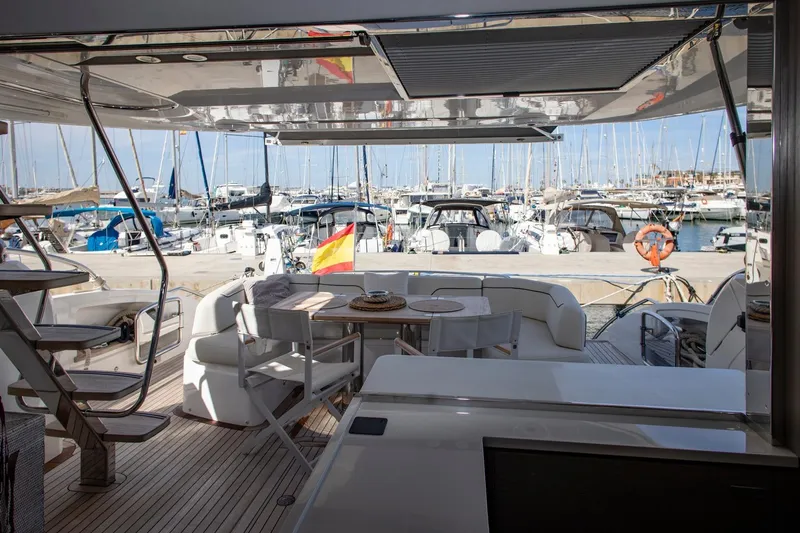  Yacht Photos Pics Luxurious 2022 Princess S66 yacht interior with marina view and elegant seating area.