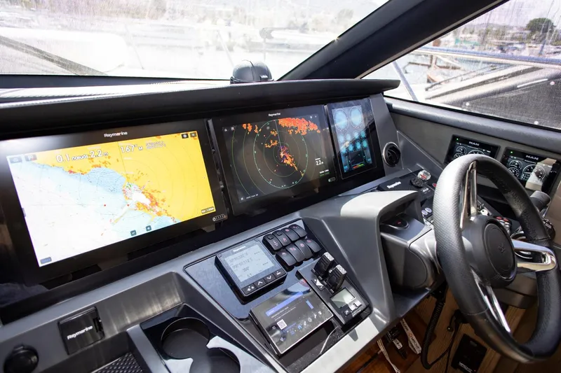  Yacht Photos Pics Modern helm of 2022 Princess S66 yacht with advanced navigation displays and controls.